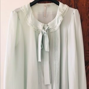 Sheer, light mint color, buttoned down blouse